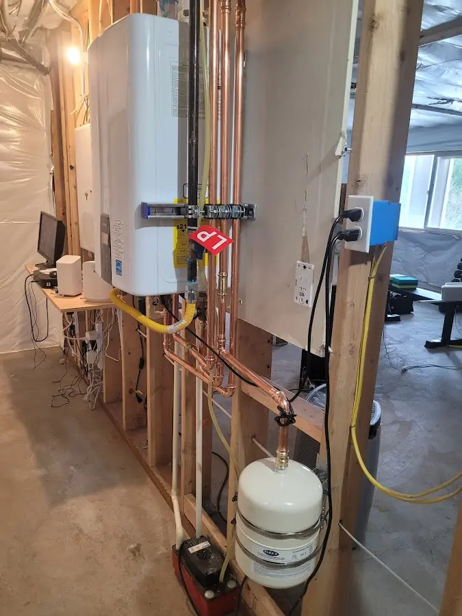 Licensed plumber repairing a kitchen sink in Ken Caryl